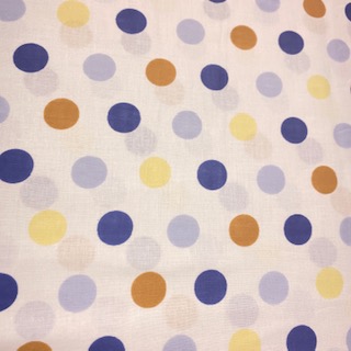 bavlana modro žlut.oran.puntíky  na bílém podkladě 150 cm