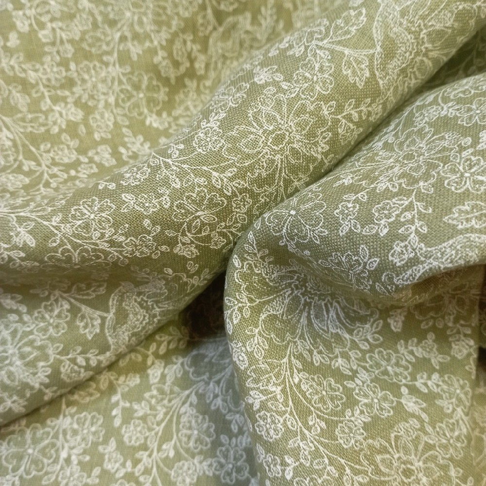 bavlna Nora  bílé kvítky na zeleném podkladě